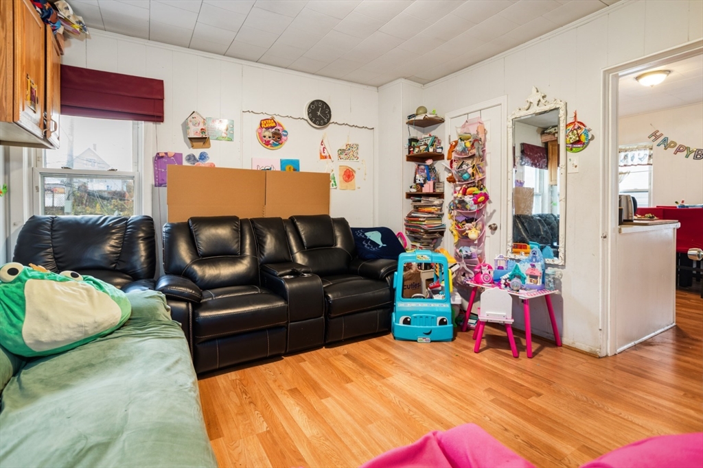 17 Ashton Street Everett, MA 02149 - Photo 12 of 42 a bedroom with furniture and a bed