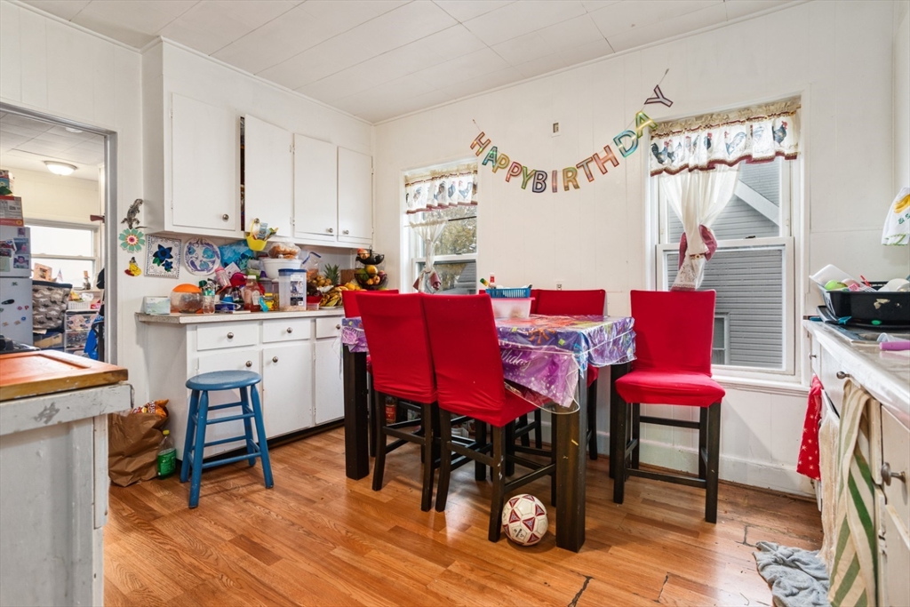 17 Ashton Street Everett, MA 02149 - Photo 13 of 42 a view of a dining room with furniture and wooden floor