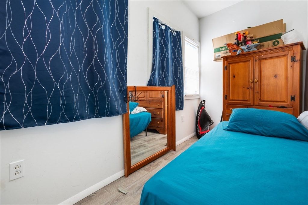 17 Ashton Street Everett, MA 02149 - Photo 18 of 42 a bedroom with a bed and a window