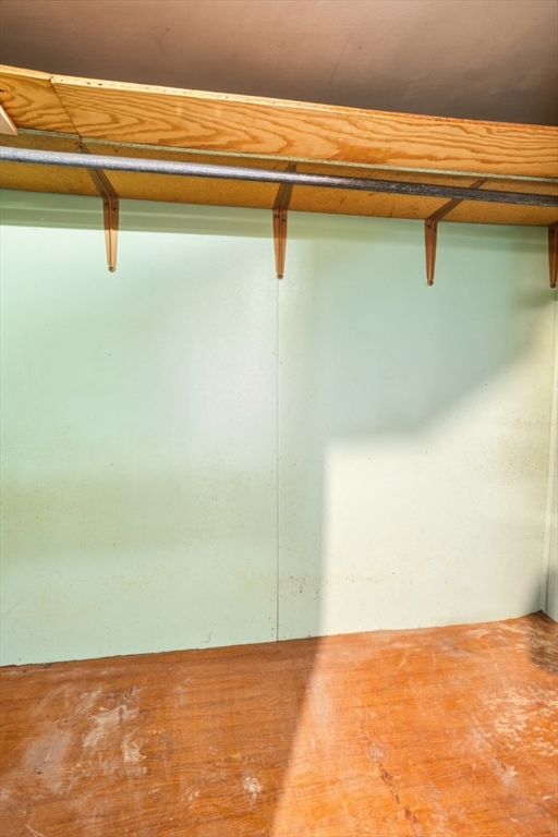 17 Ashton Street Everett, MA 02149 - Photo 39 of 42 a view of a room with racks on the wall