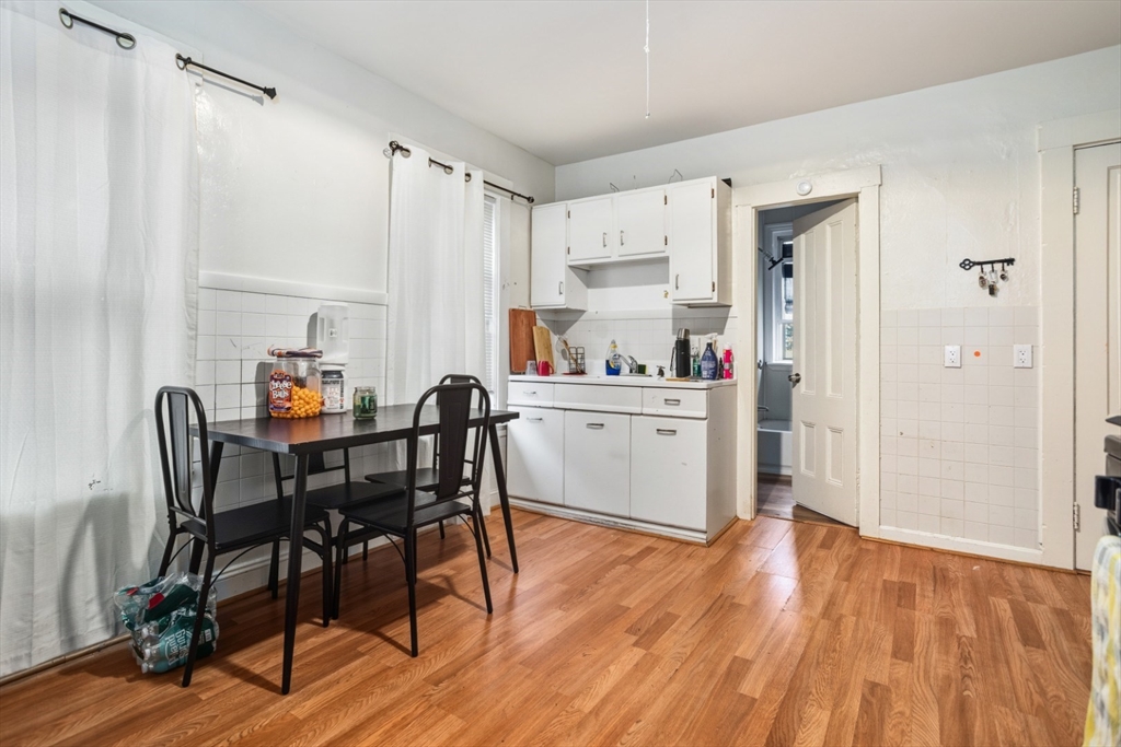 17 Ashton Street Everett, MA 02149 - Photo 8 of 42 a view of a dining room with furniture and wooden floor