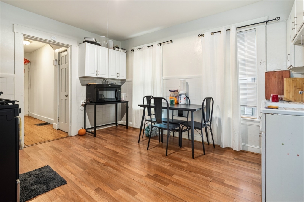 17 Ashton Street Everett, MA 02149 - Photo 9 of 42 a view of a dining room with furniture and wooden floor
