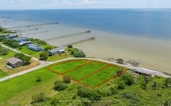 a view of a swimming pool with a yard