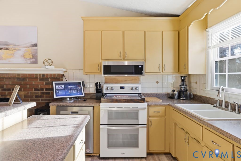 21104 Matoaca Road Petersburg, VA 23803 - Photo 11 of 22 a kitchen with appliances a sink and cabinets
