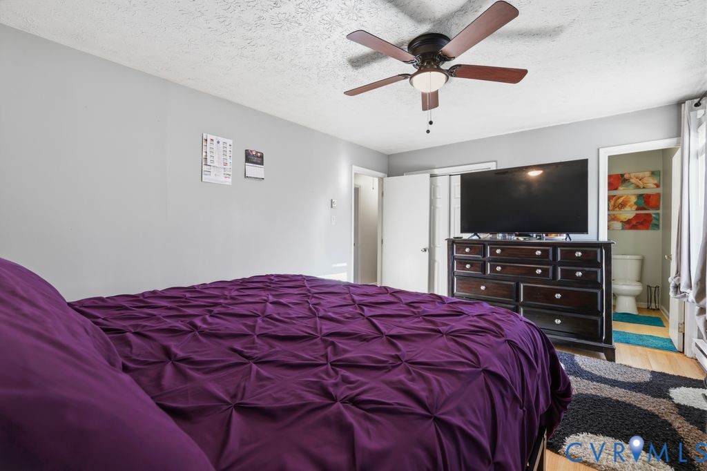21104 Matoaca Road Petersburg, VA 23803 - Photo 14 of 22 a bedroom with a bed and a flat screen tv