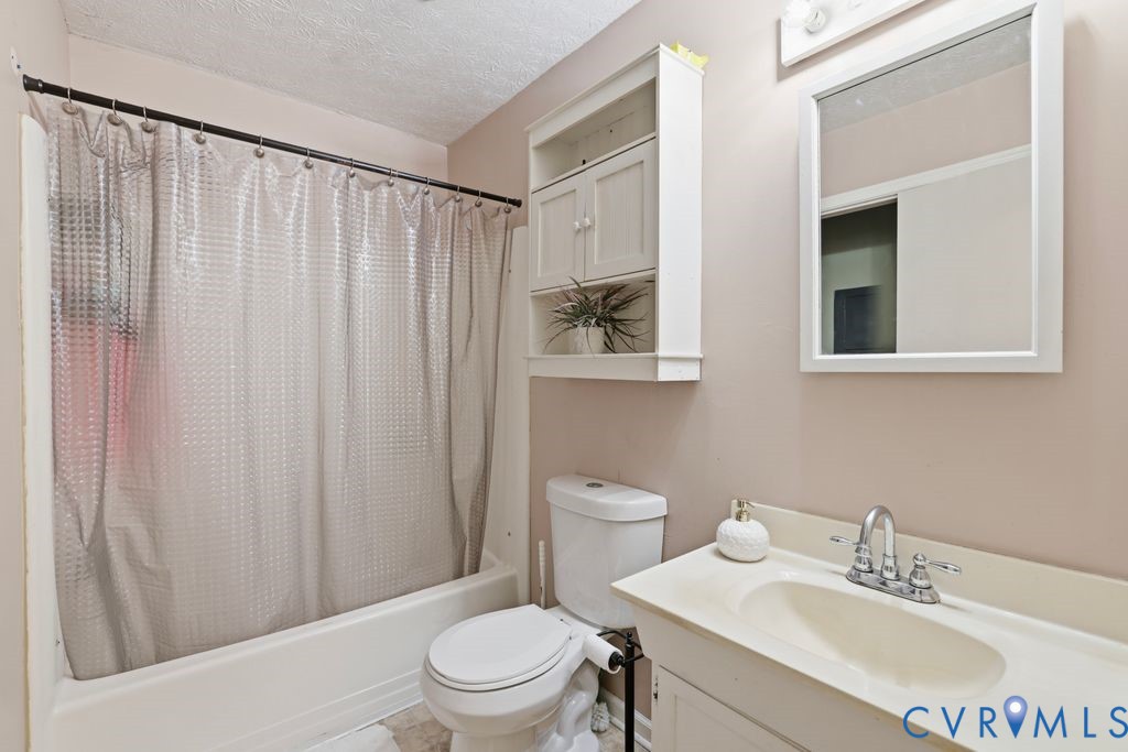 21104 Matoaca Road Petersburg, VA 23803 - Photo 15 of 22 a white toilet sitting next to a bathroom sink