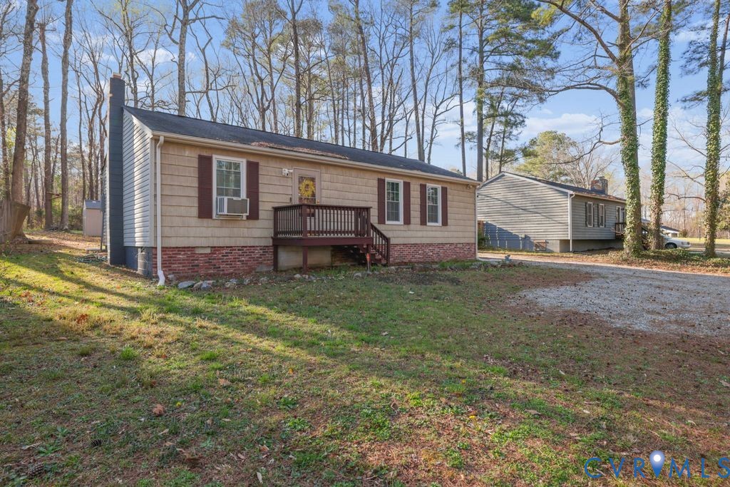 21104 Matoaca Road Petersburg, VA 23803 - Photo 2 of 22 front view of house with a yard