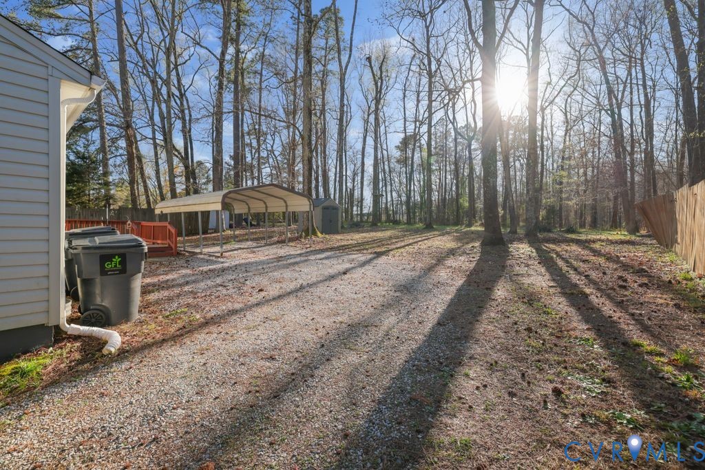 21104 Matoaca Road Petersburg, VA 23803 - Photo 22 of 22 a view of a backyard with large trees
