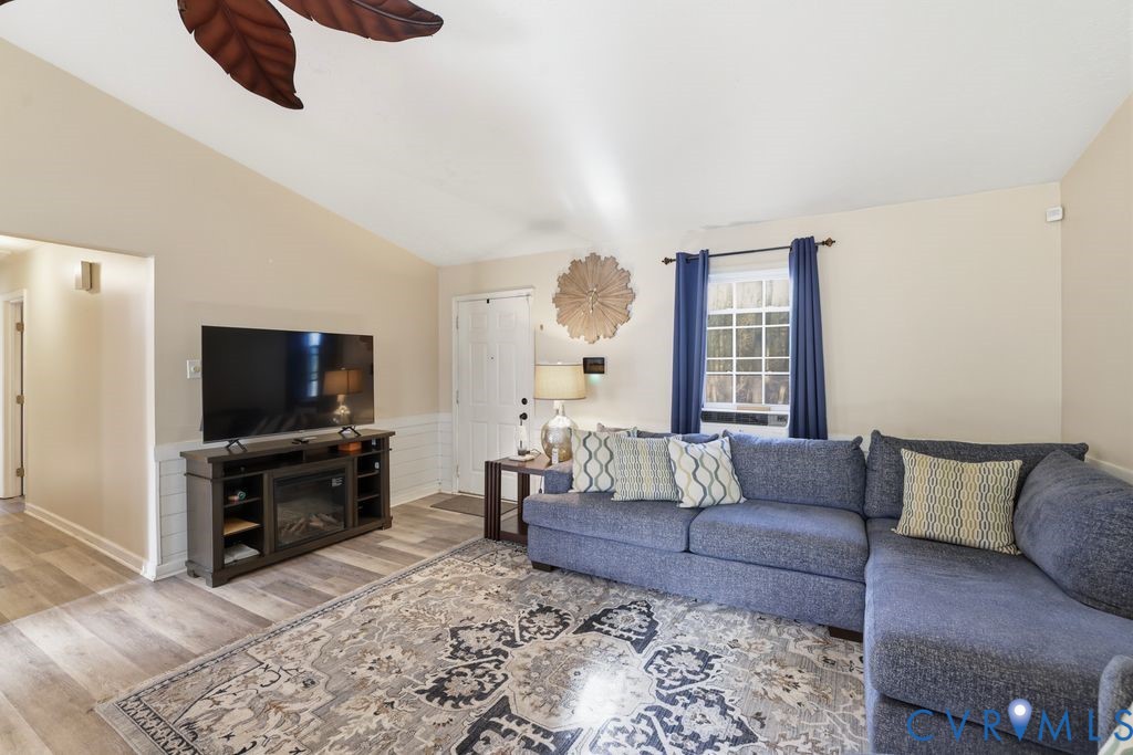 21104 Matoaca Road Petersburg, VA 23803 - Photo 6 of 22 a living room with furniture and a flat screen tv
