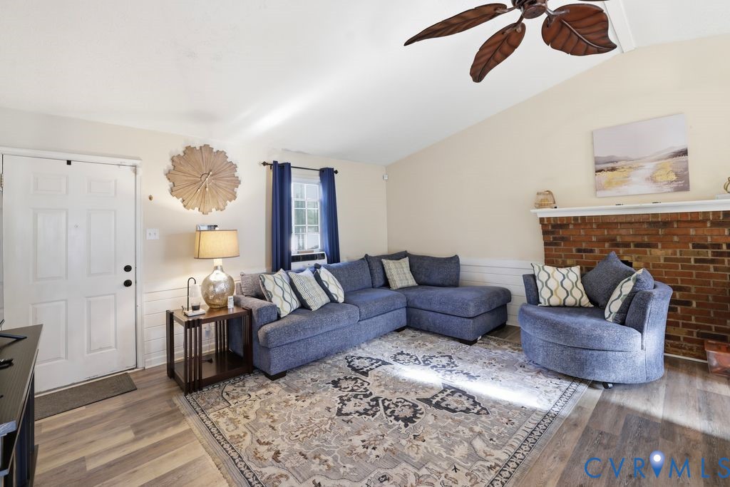 21104 Matoaca Road Petersburg, VA 23803 - Photo 7 of 22 a living room with furniture and a fireplace