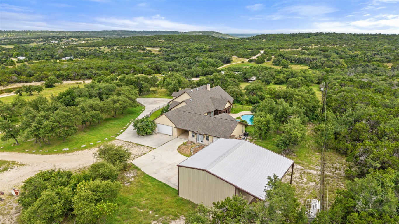 270 Rollin N Ranch Road Blanco, TX 78606 - Photo 11 of 27 an aerial view of residential houses with outdoor space and trees