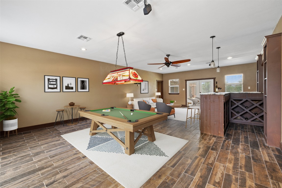 270 Rollin N Ranch Road Blanco, TX 78606 - Photo 14 of 27 a living room with furniture a table and a chandelier