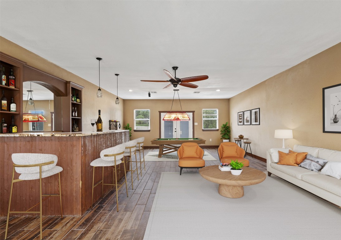 270 Rollin N Ranch Road Blanco, TX 78606 - Photo 15 of 27 a living room with furniture and wooden floor