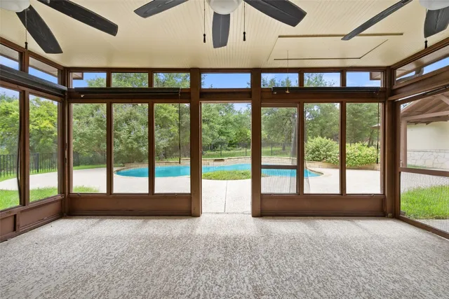 a view of an empty room with a balcony