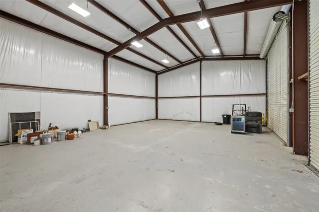 a view of a garage with cars