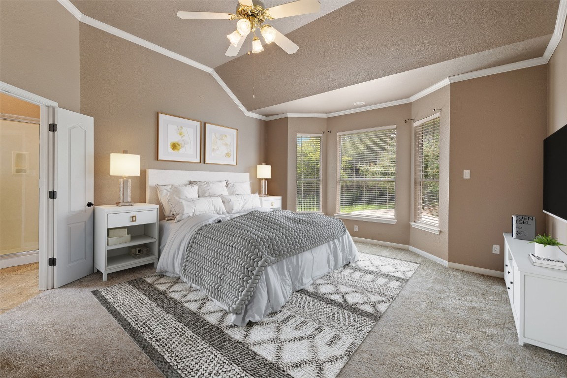 270 Rollin N Ranch Road Blanco, TX 78606 - Photo 23 of 27 a bedroom with a bed and a chandelier