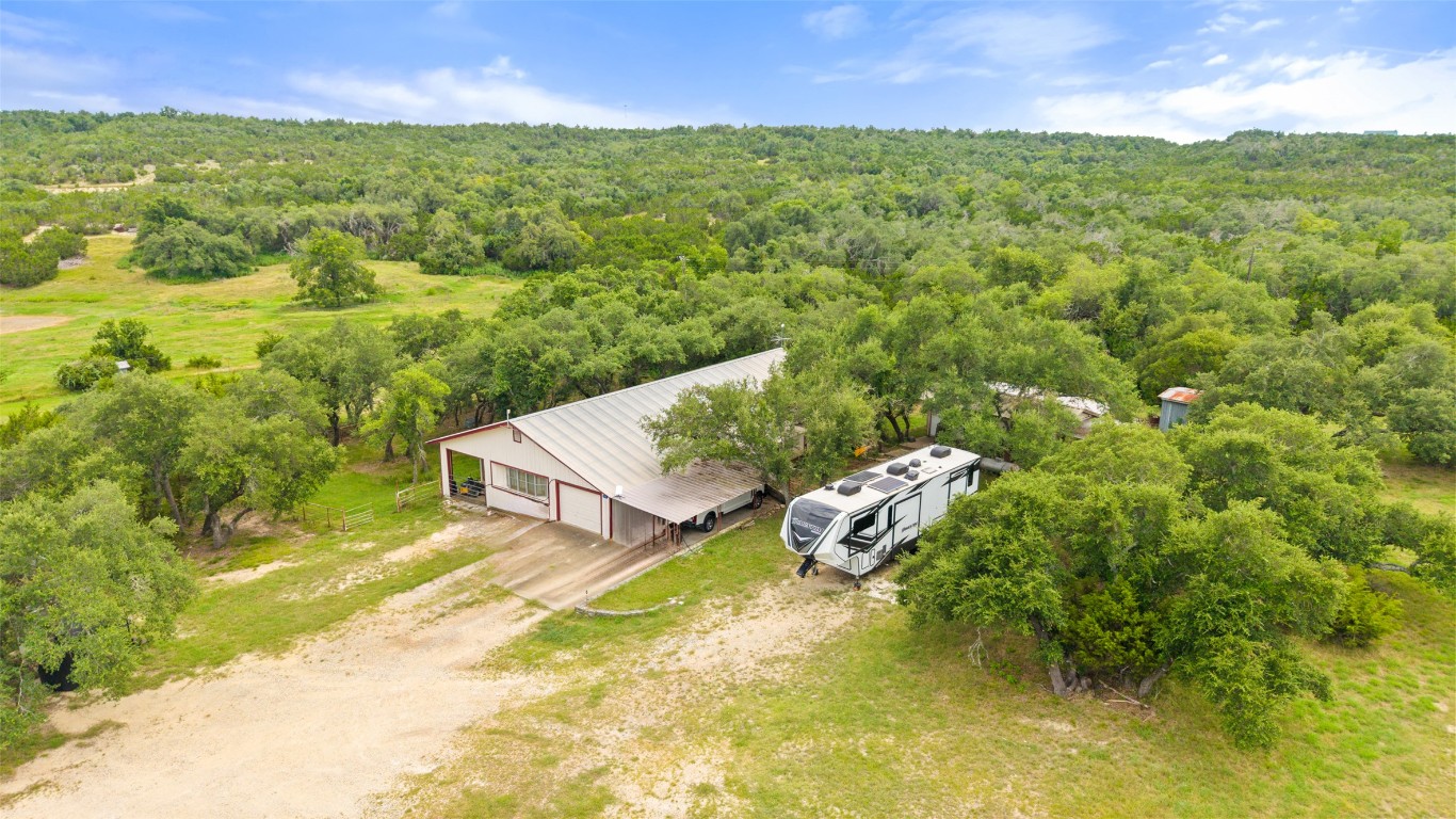 270 Rollin N Ranch Road Blanco, TX 78606 - Photo 24 of 27 a view of a big yard with table and chairs