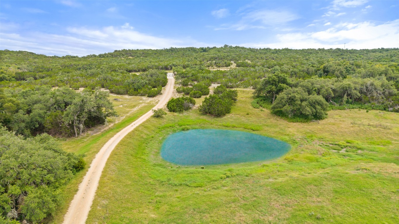 270 Rollin N Ranch Road Blanco, TX 78606 - Photo 4 of 27 a view of a lake with a yard