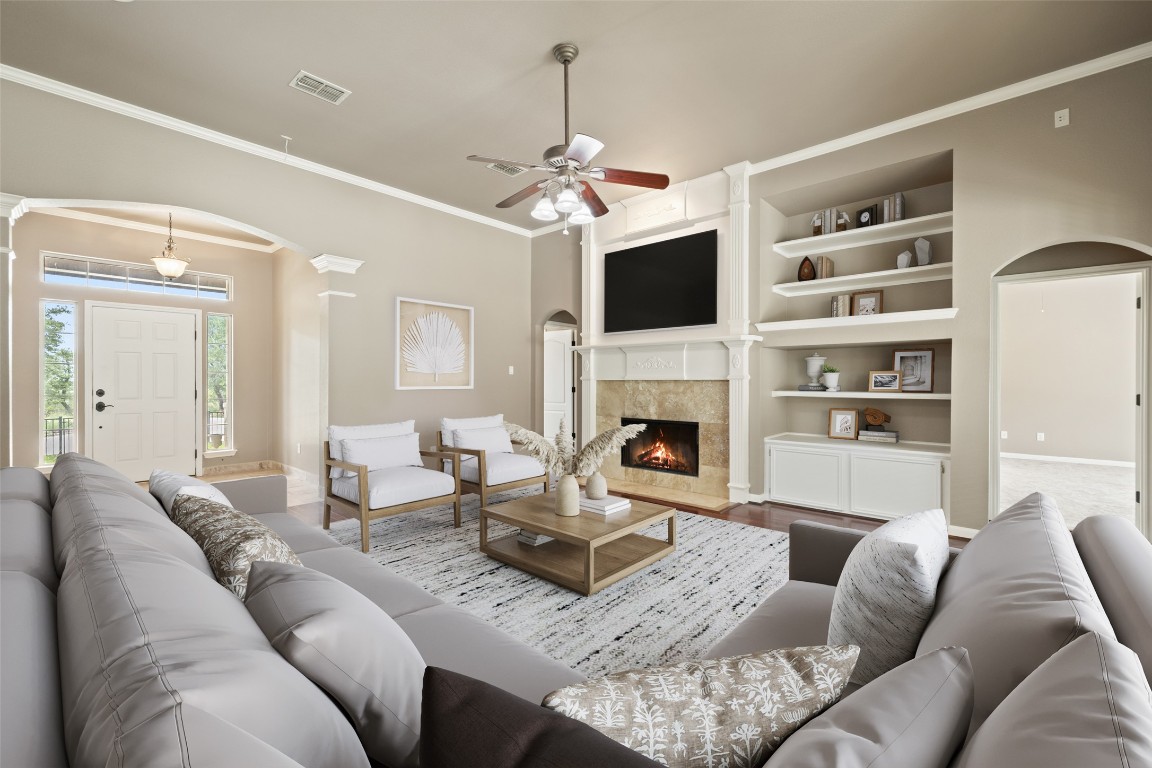 270 Rollin N Ranch Road Blanco, TX 78606 - Photo 5 of 27 a living room with furniture a fireplace and a flat screen tv
