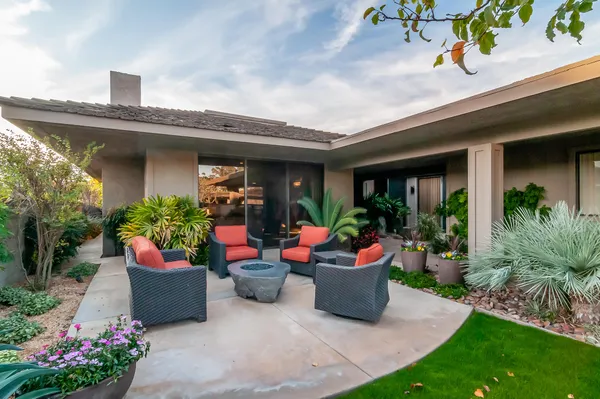 a front view of a house with sitting space