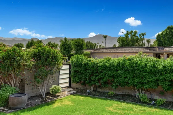 a backyard of a house with lots of green space