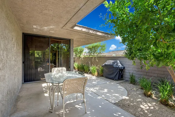 a view of a table and chairs in patio