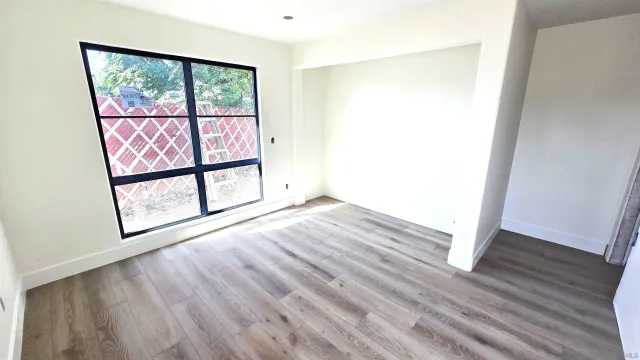 a view of front door with wooden floor