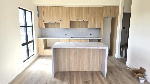 a kitchen with wooden cabinets and a sink