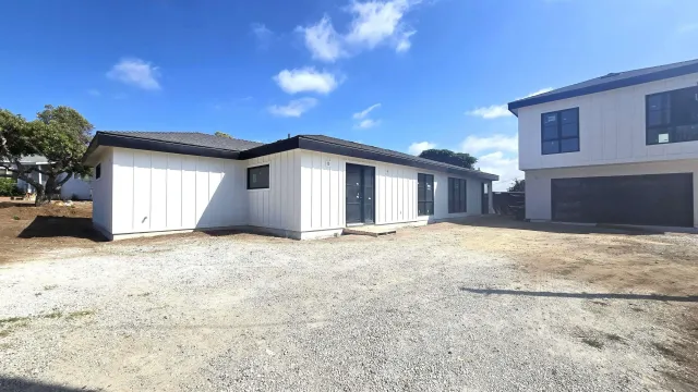 a view of a house with a yard and garage