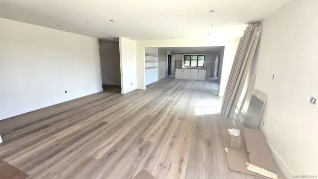 wooden floor in a hall with an entryway