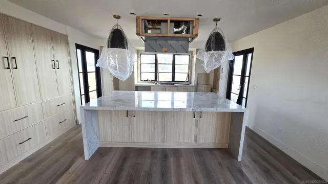 a view of cabinets and wooden floor