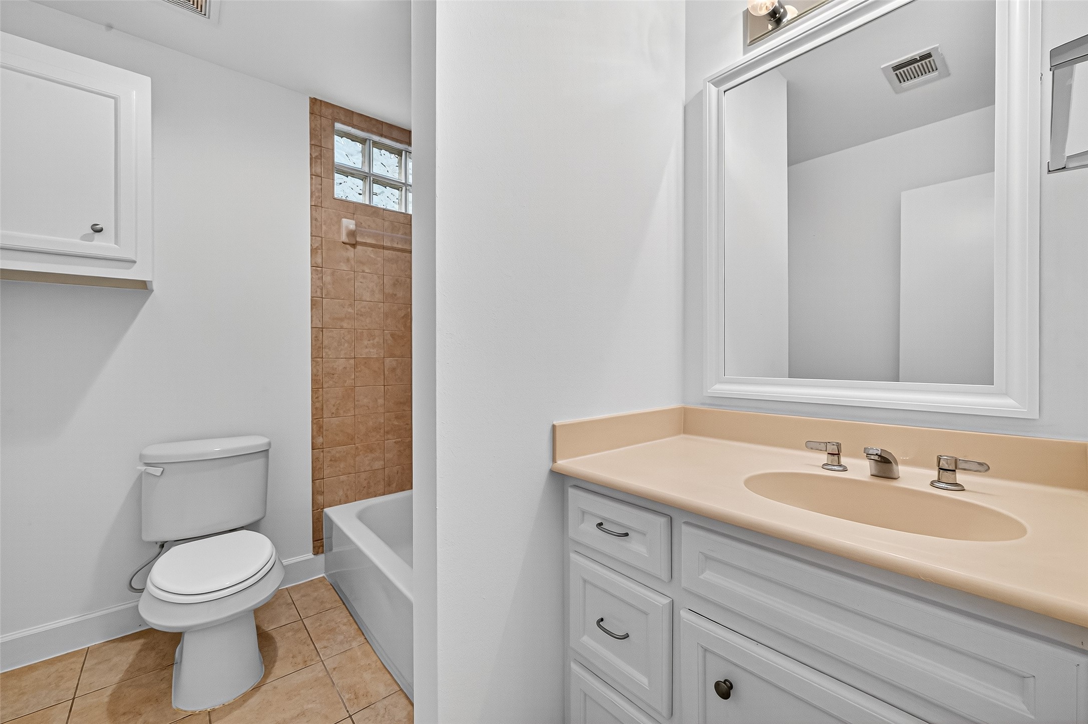 2710 Hullsmith Drive, Unit 1303 Houston, TX 77063 - Photo 11 of 25 a bathroom with a sink a toilet and shower