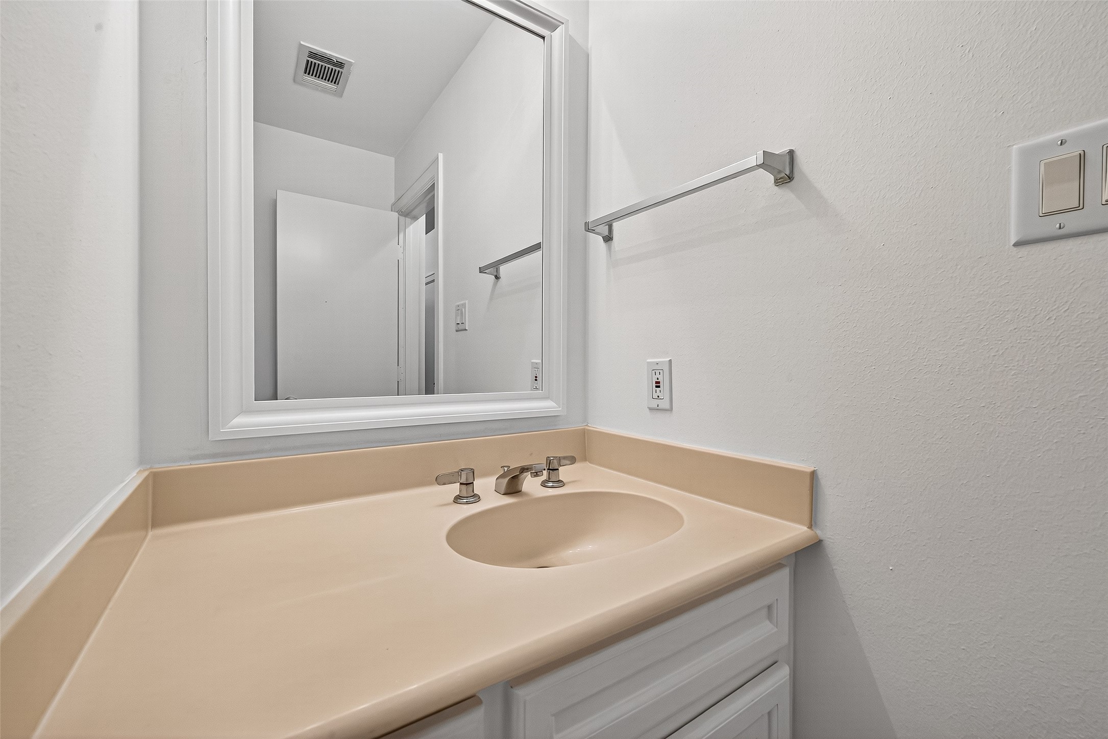 2710 Hullsmith Drive, Unit 1303 Houston, TX 77063 - Photo 12 of 25 a bathroom with a sink and a mirror