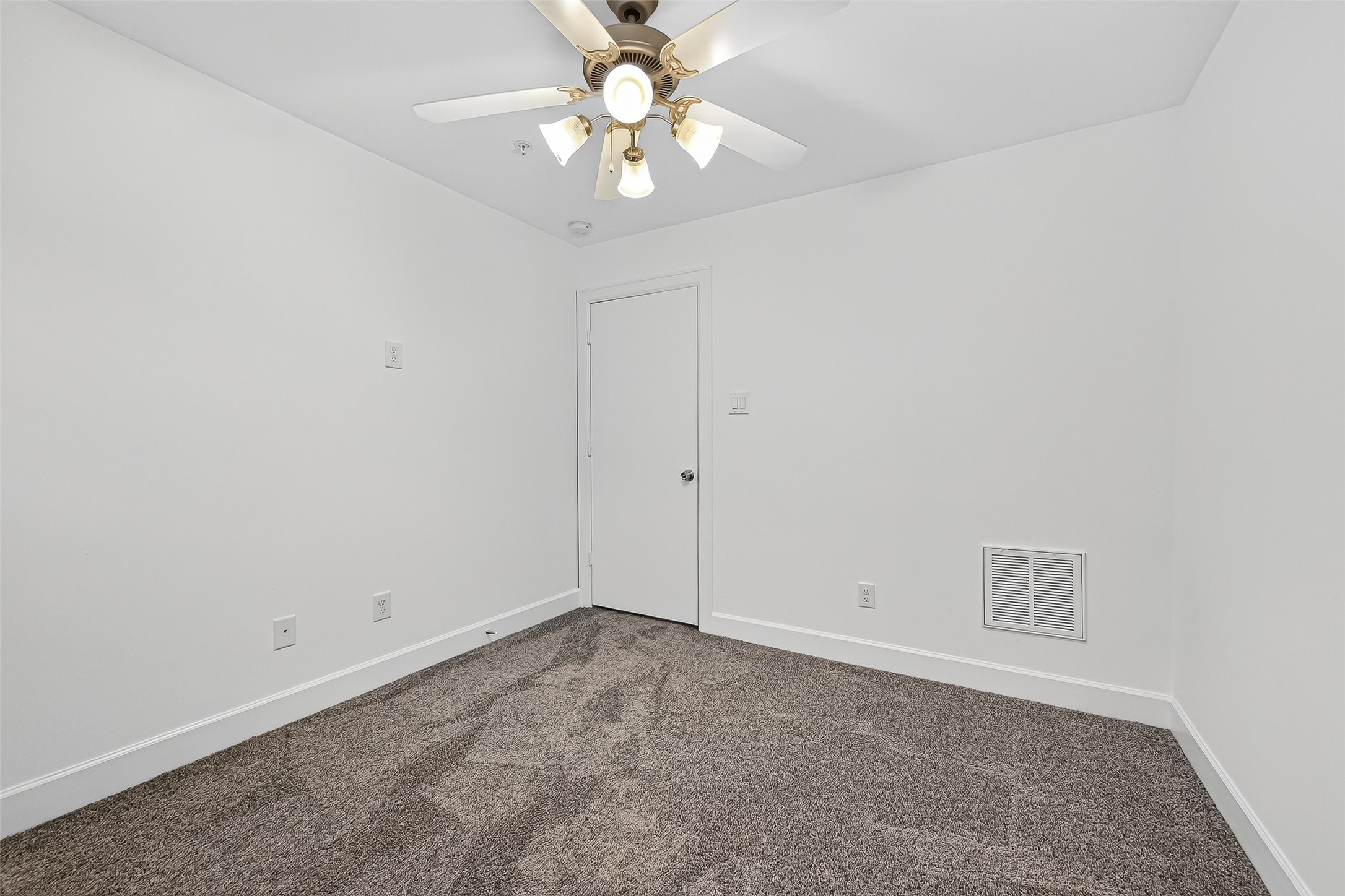2710 Hullsmith Drive, Unit 1303 Houston, TX 77063 - Photo 16 of 25 an empty room with a window and a chandelier fan