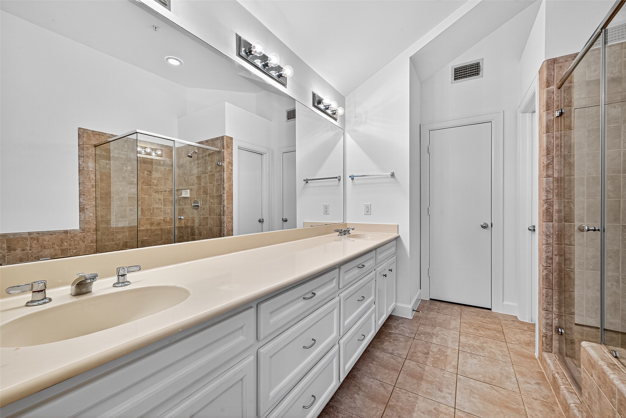 2710 Hullsmith Drive, Unit 1303 Houston, TX 77063 - Photo 19 of 25 a spacious bathroom with a double vanity sink mirror and double