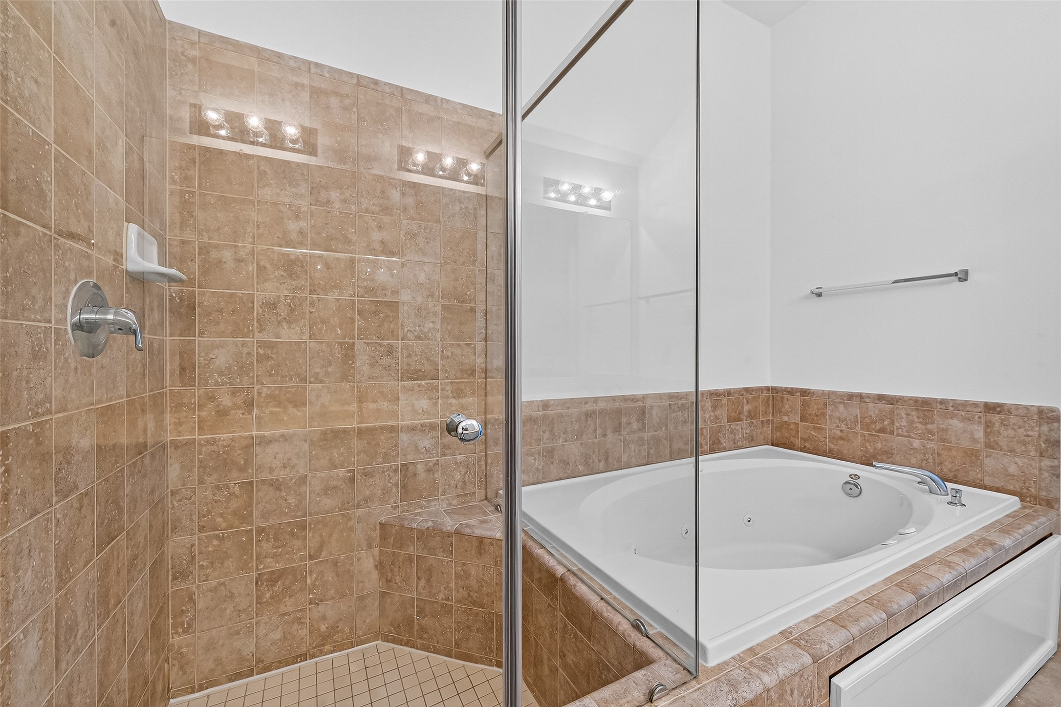 2710 Hullsmith Drive, Unit 1303 Houston, TX 77063 - Photo 20 of 25 a bathroom with a bathtub and shower