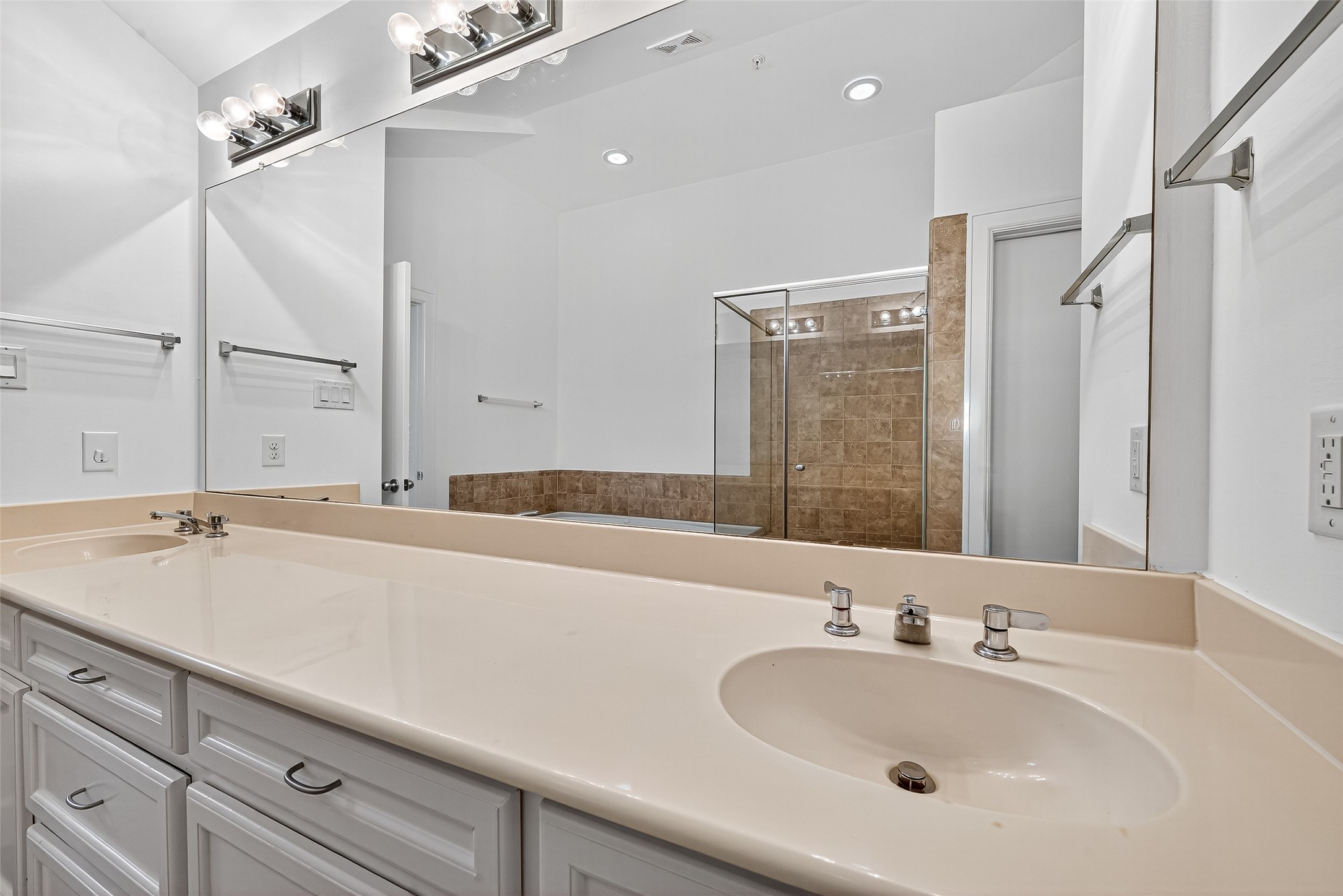 2710 Hullsmith Drive, Unit 1303 Houston, TX 77063 - Photo 21 of 25 a bathroom with a sink and a large mirror