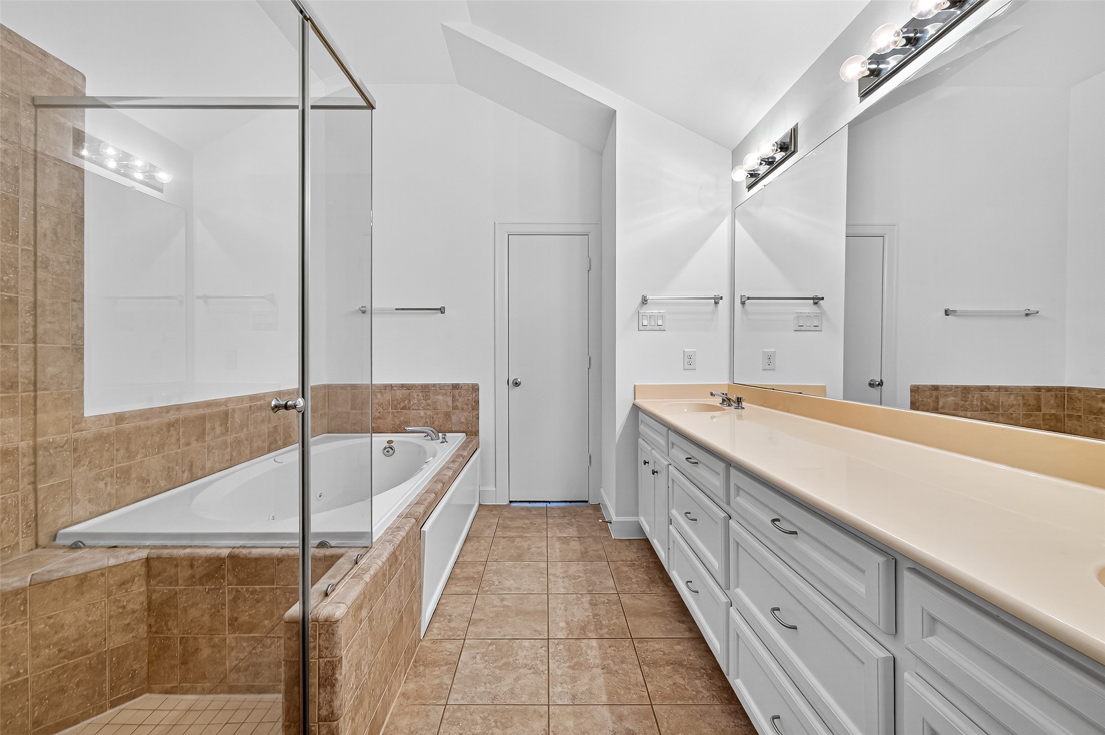 2710 Hullsmith Drive, Unit 1303 Houston, TX 77063 - Photo 22 of 25 a bathroom with a tub sink and mirror