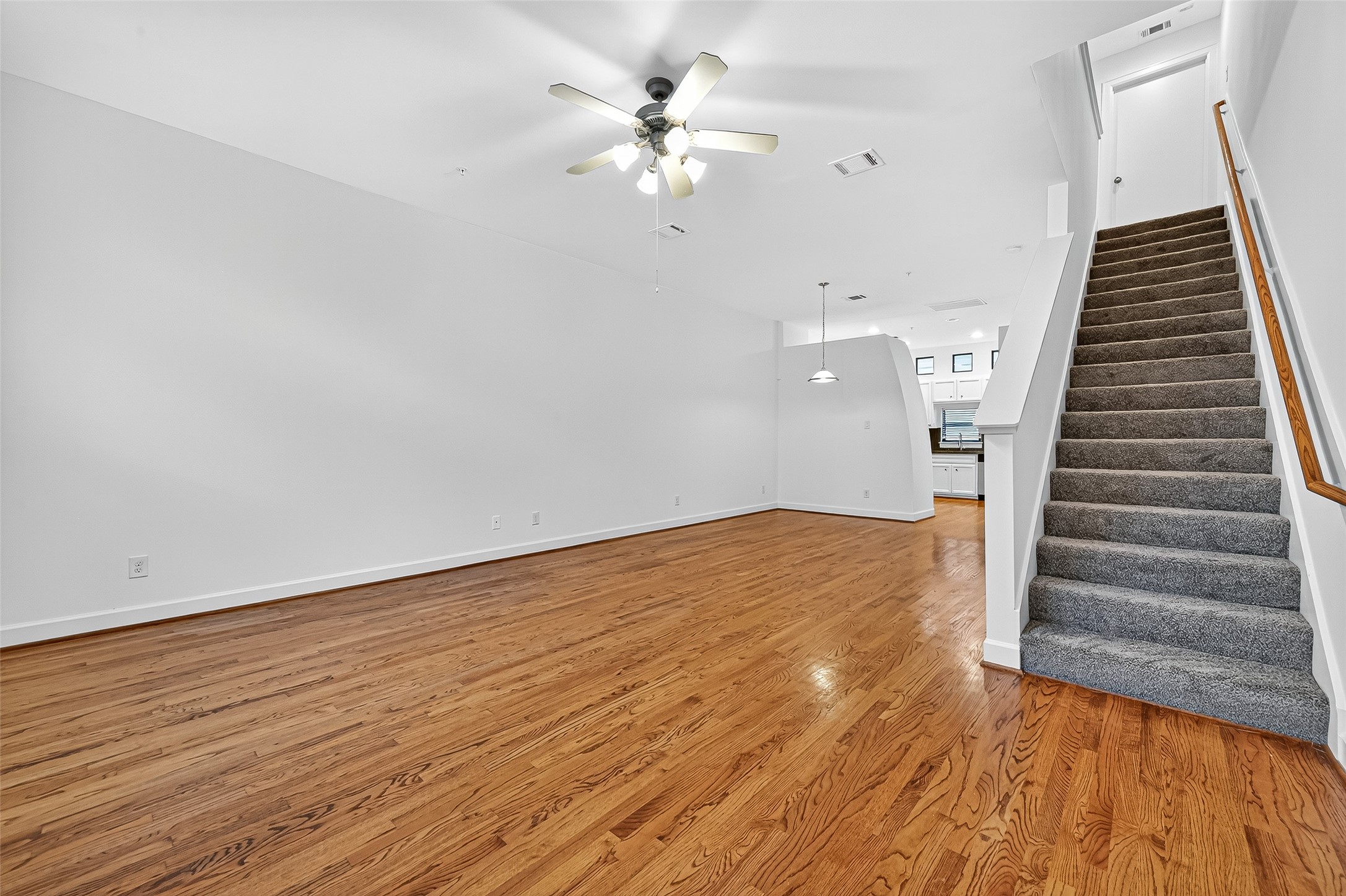 2710 Hullsmith Drive, Unit 1303 Houston, TX 77063 - Photo 6 of 25 a view of entryway and hall with wooden floor