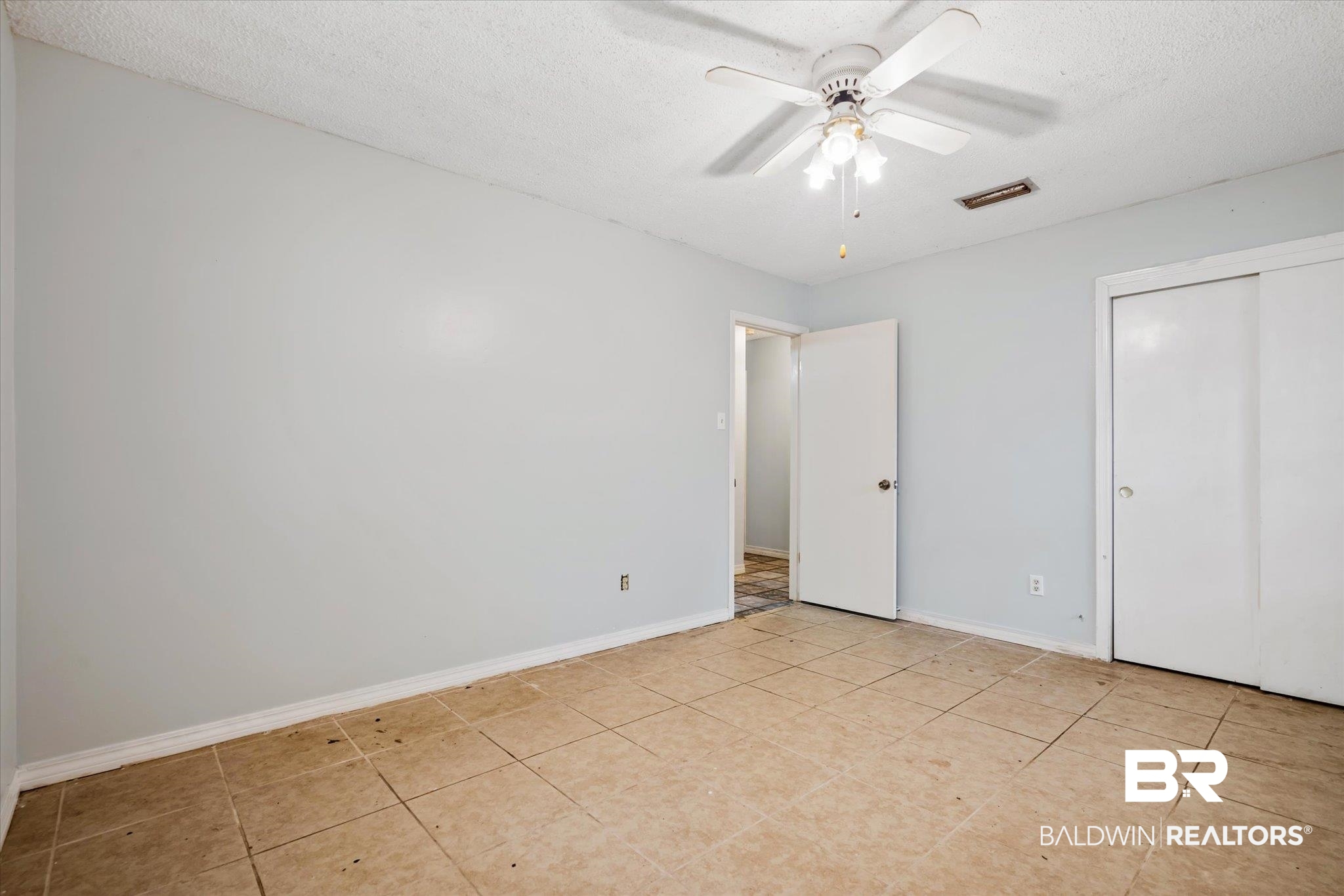 6657 Hounds Run South Mobile, AL 36608 - Photo 14 of 20 Unfurnished bedroom featuring a textured ceiling and ceiling fan