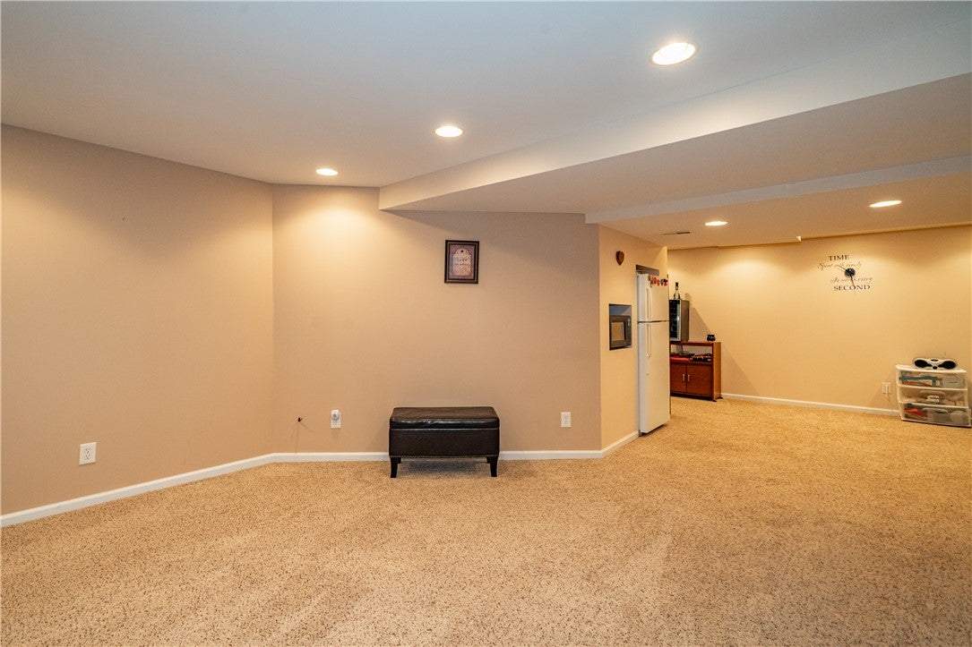 10765 Stone Ridge Way Harrison, OH 45030 - Photo 45 of 68 A versatile basement retreat with inviting carpet and abundant recessed lighting.