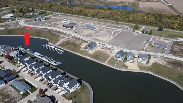 an aerial view of a residential houses with outdoor space
