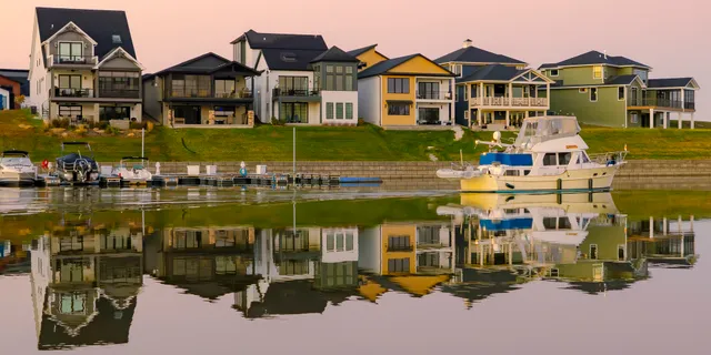 a front view of a house with a lake view
