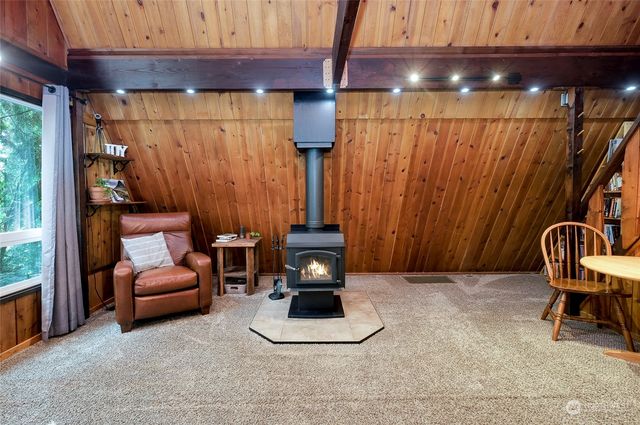 a room with wooden furniture and a window