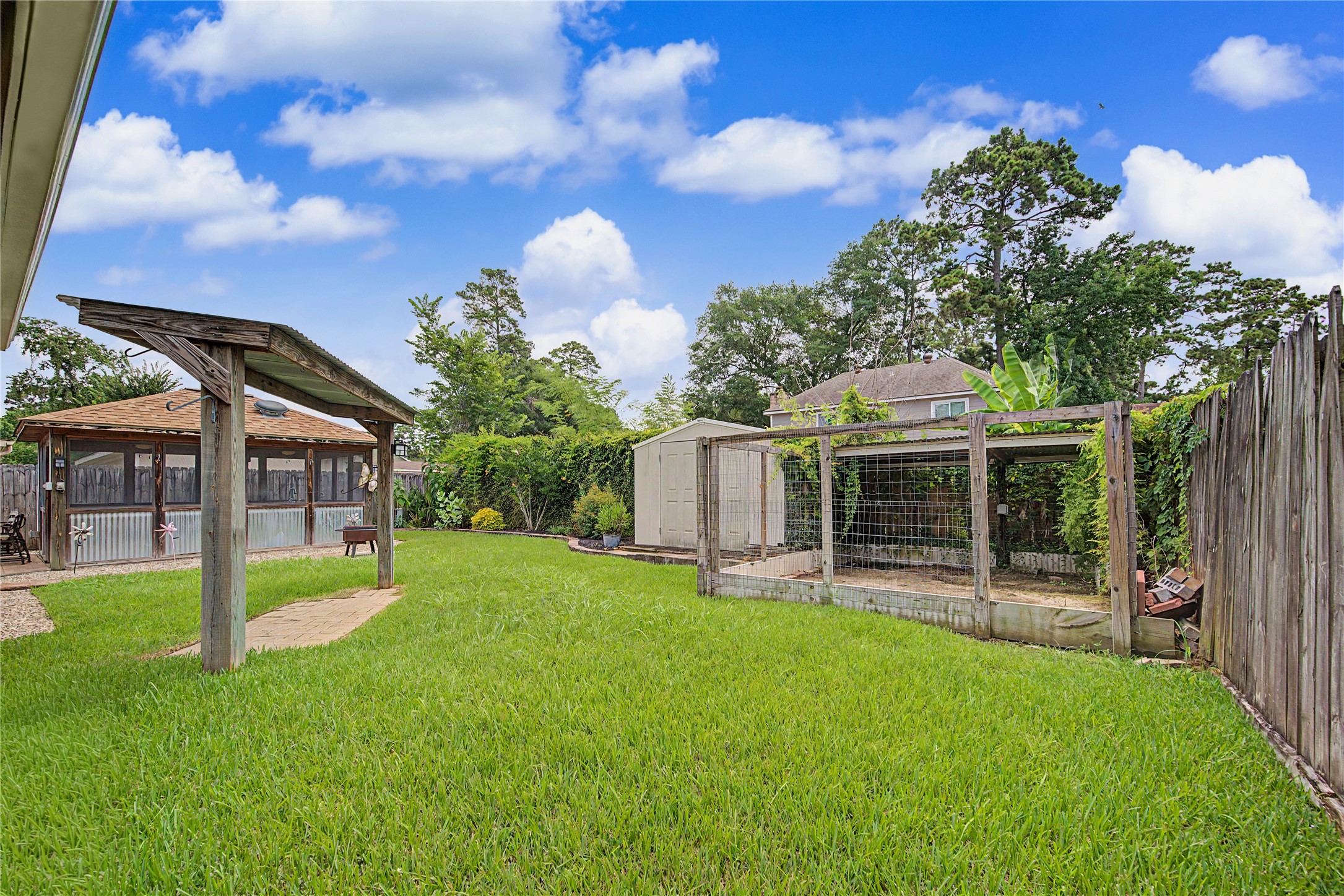 4210 Mossygate Drive Spring, TX 77373 - Photo 32 of 33 Additional fenced outdoor enclosure with electricity — great for pets or flexible outdoor use.
