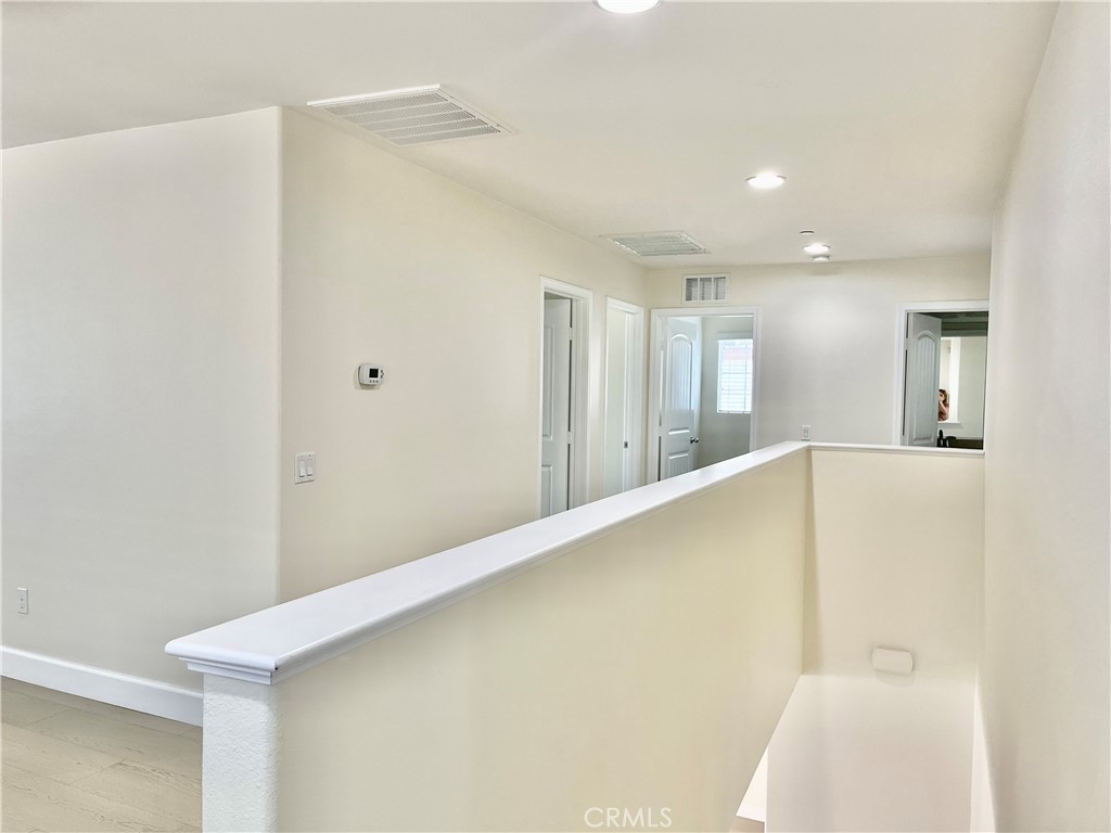 736 Tangelo Way Fullerton, CA 92832 - Photo 12 of 36 a view of a hallway with a refrigerator