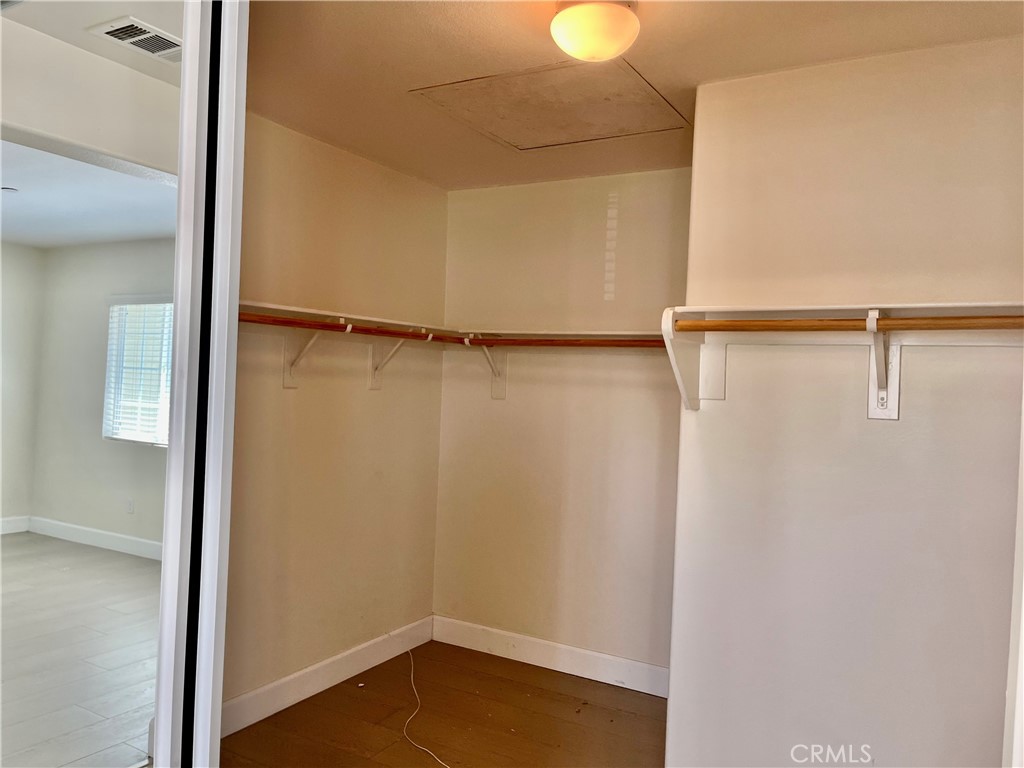 736 Tangelo Way Fullerton, CA 92832 - Photo 17 of 36 a view of walk in closet with empty racks