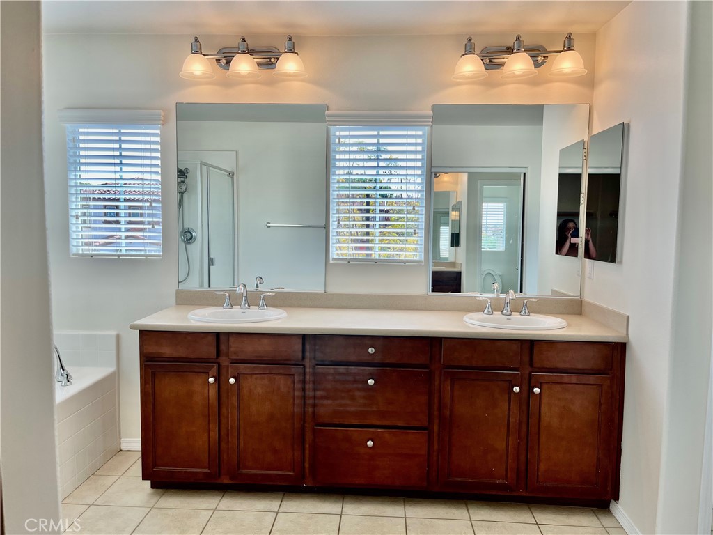 736 Tangelo Way Fullerton, CA 92832 - Photo 18 of 36 a spacious bathroom with a double vanity sink and a mirror