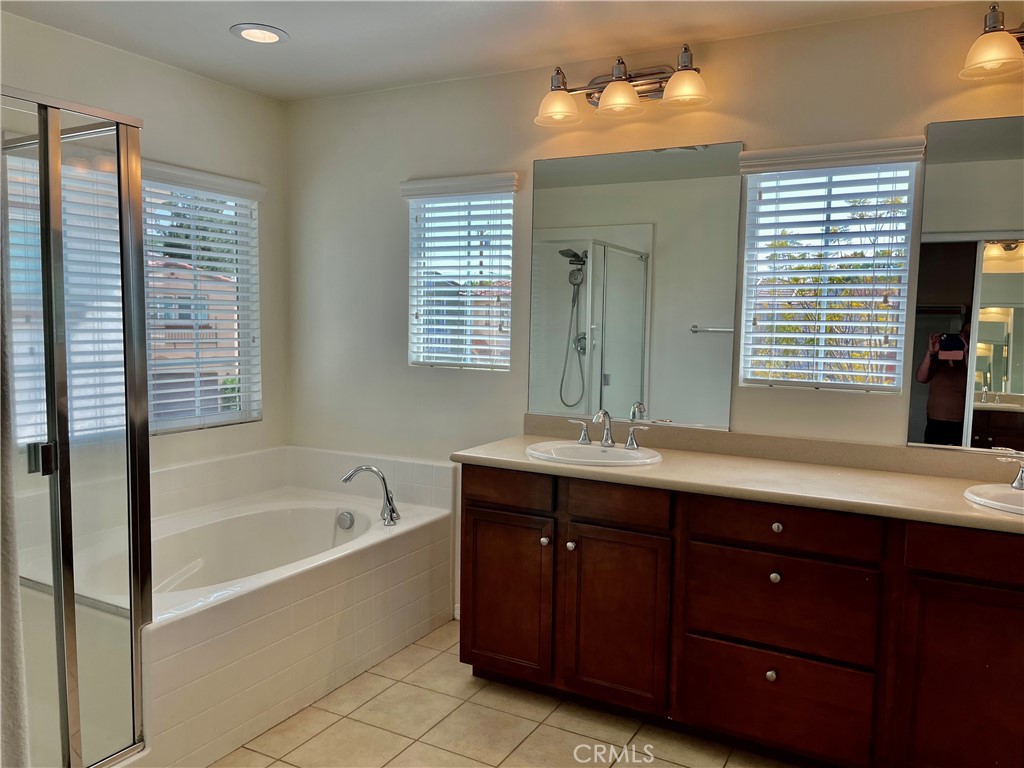 736 Tangelo Way Fullerton, CA 92832 - Photo 19 of 36 a bathroom with a tub sink double vanity and mirror