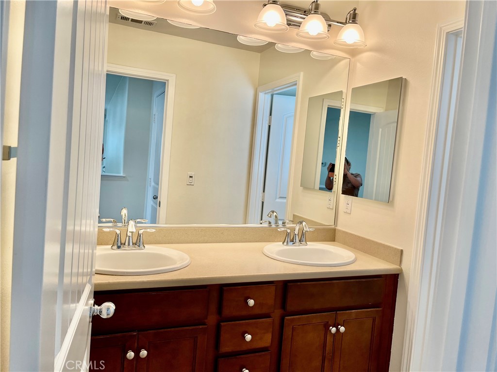 736 Tangelo Way Fullerton, CA 92832 - Photo 26 of 36 a bathroom with a sink double vanity and a mirror